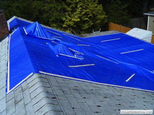 After - Cut holes in main tarp; apply small tarps over tall roof vents