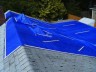 After - Cut holes in main tarp; apply small tarps over tall roof vents