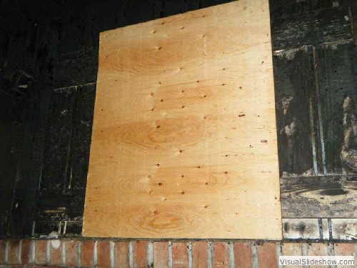 Exterior After - Security screws used to attach plywood to exterior of house